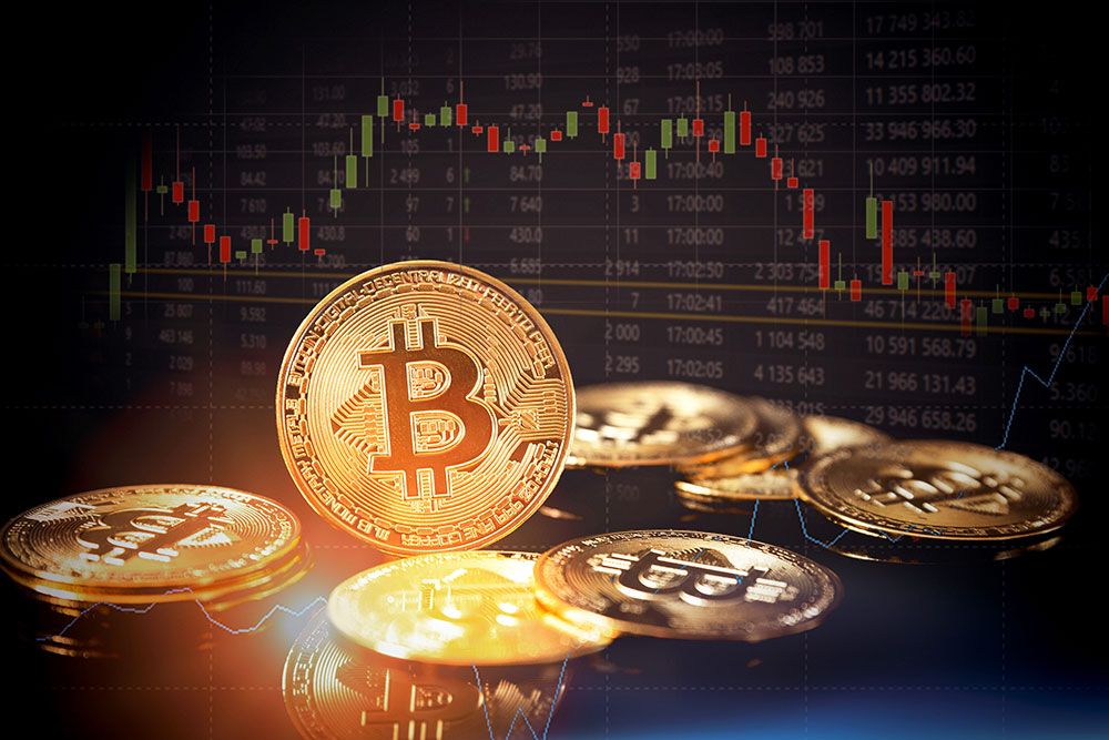 A gold bit coin sits around a pile of other coins. a market trend line shown above the coins